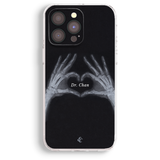 a phone case with a black background and a graphic of two skeletal hands forming a heart shape.