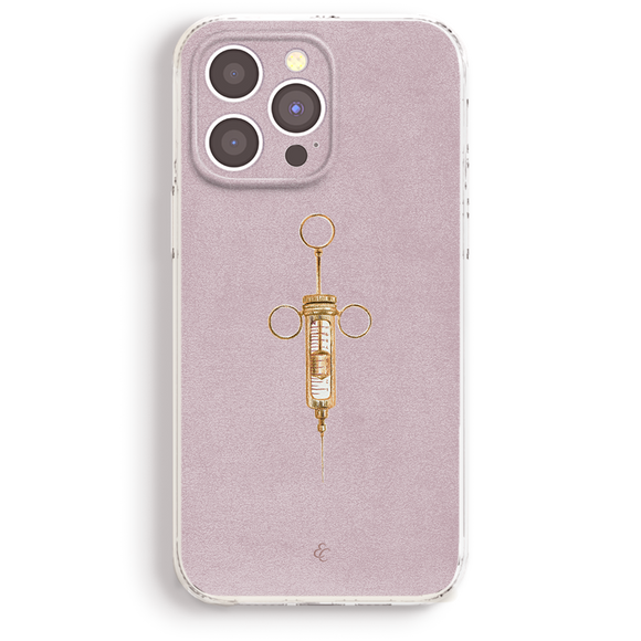a phone case with a gold syringe design on it.