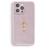 a phone case with a gold syringe design on it.