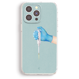 A hand wearing blue gloves is holding a pipette, which is a tool used for precise liquid handling in laboratory settings.