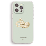 a phone case with a printed illustration of a coiled snake or snake on a light green background.